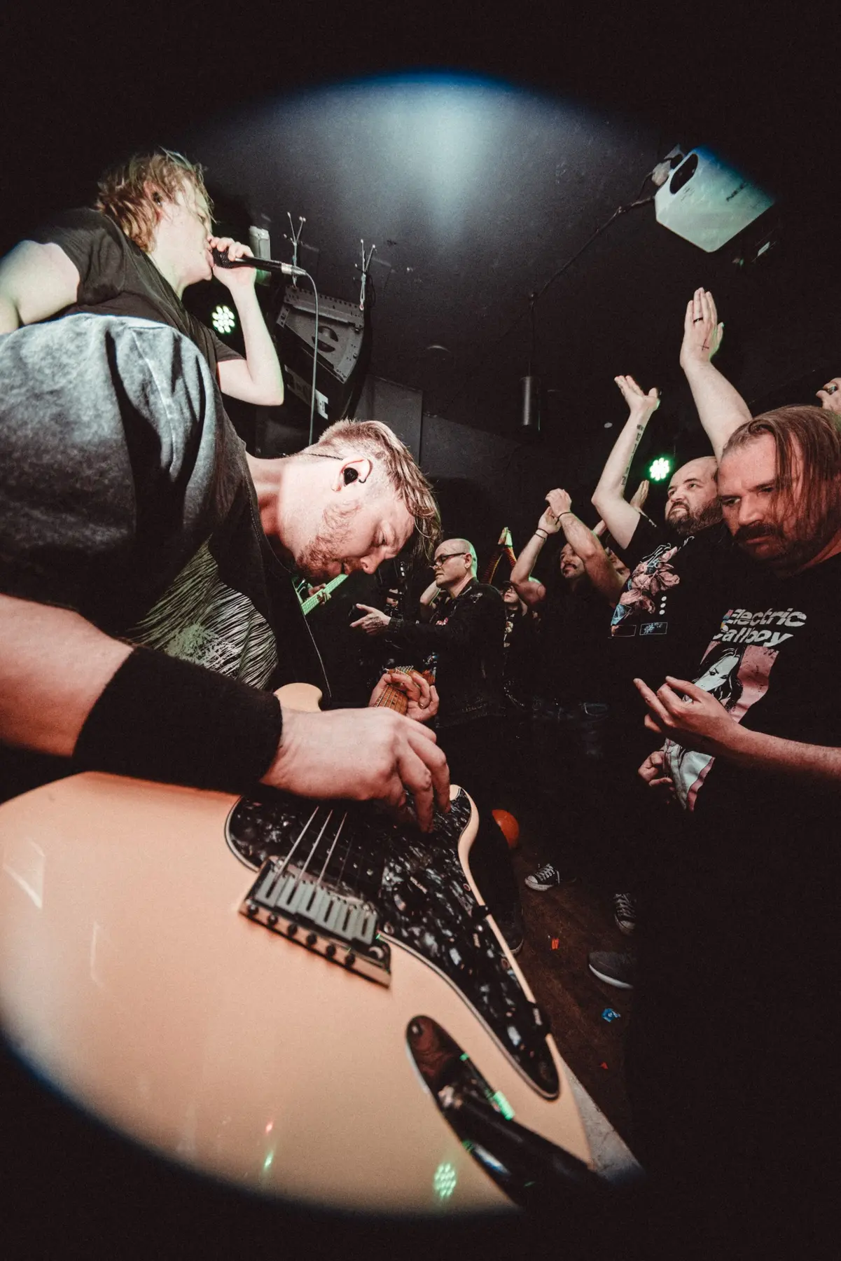 Guitarist playing close to a live audience